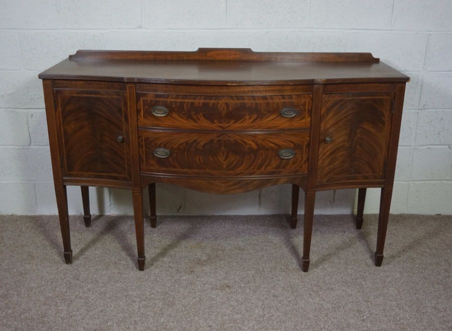 A George III style mahogany sideboard, reproduction, 20th century, with two drawers, flanked by