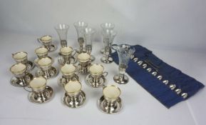 A set of six glass and silver mounted champagne flutes, together with a set of Lenox porcelain