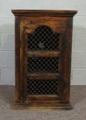 A Spanish provincial chestnut wall cabinet, with a moulded cornice over a single arched and iron