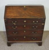 A George III mahogany bureau, 18th century, with fall front opening to reveal an arrangement of