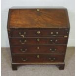 A George III mahogany bureau, 18th century, with fall front opening to reveal an arrangement of