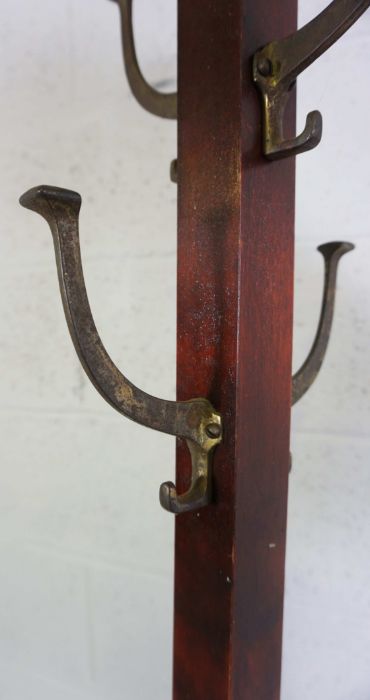 An Edwardian coat stand, with brass fittings, on square section column and x framed sledge foot - Image 2 of 2