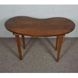 A kidney shaped table, modern, on plain tapered legs