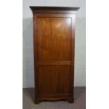 A George III style mahogany single wardrobe, with moulded cornice over a single panelled door, 175