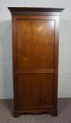 A George III style mahogany single wardrobe, with moulded cornice over a single panelled door, 175