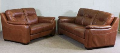 Pair of leather sofas, modern, upholstered in tan, one thee seater, 207cm wide, the other two