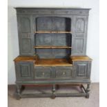 A 19th century Lancashire style dresser, later painted, the moulded cornice over shelves, flanked by