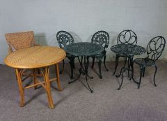 Two sets of painted garden tables with matching pairs of chairs, and a wicker table and chair (8)