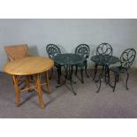 Two sets of painted garden tables with matching pairs of chairs, and a wicker table and chair (8)