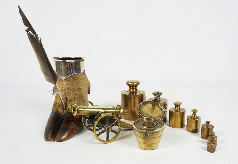 A silver plated and deer foot mounted inkwell, 13cm high; with a graduated set of brass weights (a