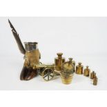 A silver plated and deer foot mounted inkwell, 13cm high; with a graduated set of brass weights (a