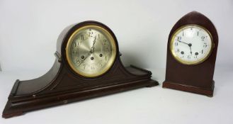 Two American mahogany cased mantel clocks, one with an arched topped case, 20cm high, the other with