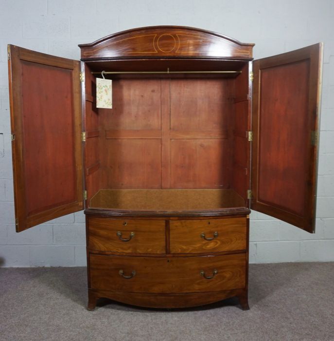 A George IV mahogany bowfront linen press, first half 19th century, with an arched cornice over - Image 2 of 7