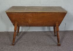 A provincial elm Dough Bin, 19th century, with a rectangular hinged top, above tapering sides and