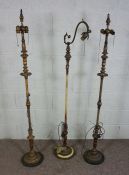 Three assorted gilt and painted metal standard lamps, tallest 158cm high (3)