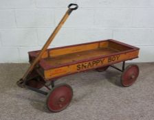 A rare vintage ‘Snappy Boy’ child’s handcart, circa 1930, with a painted wooden open floor, hinged