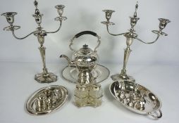 An assortment of silver plate, including a pair of Georgian style three light candelabra, a hot
