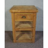 A provincial pine butchers block, 20th century, the thickly planked square top over a single knife