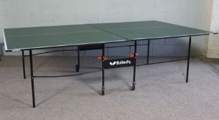 A folding Ping Pong table, by Butterfly, with assorted fittings and bats (a lot)