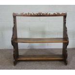 A small Scottish provincial walnut and oak hanging bookshelf, 19th century, the crest fretwork