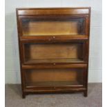A Globe Wernicke style three section bookcase, each shelf with a glazed hinged door, 20th century,