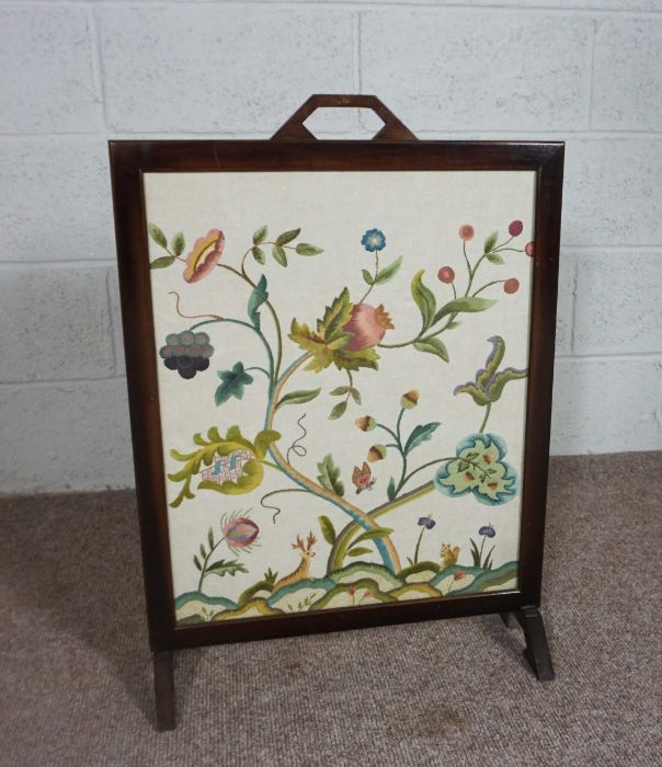 A firescreen, with decorative tapestry panel, modern