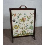 A firescreen, with decorative tapestry panel, modern