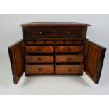 A Victorian mahogany and walnut 'Apprentice' chest, late 19th century, the moulded hinged top,