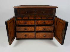 A Victorian mahogany and walnut 'Apprentice' chest, late 19th century, the moulded hinged top,