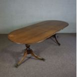 A Regency style mahogany veneered twin pillar extending dining table, with one additional leaf, 73cm