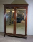 A George III style mahogany double compactum wardrobe, by Paterson, Smith & Innes, Edinburgh, with