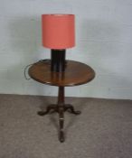 A George II style mahogany wine table, with hinged circular top and birdcage and pillar support on