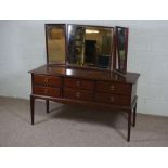 A dressing table, late 20th century, with triple mirror over six drawers, 128cm high, 130cm wide