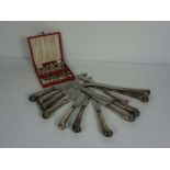 A set of twelve 19th century silver handled pistol grip table knives, the blades stamped Bullock,