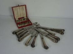 A set of twelve 19th century silver handled pistol grip table knives, the blades stamped Bullock,