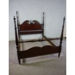 A George III style mahogany framed bed, 20th century reproduction, the headboard with a swan