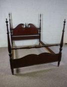 A George III style mahogany framed bed, 20th century reproduction, the headboard with a swan
