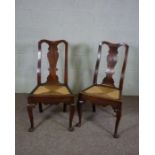 A pair of Queen Anne ash and oak framed dining chairs, with baluster carved splat, rush seat over