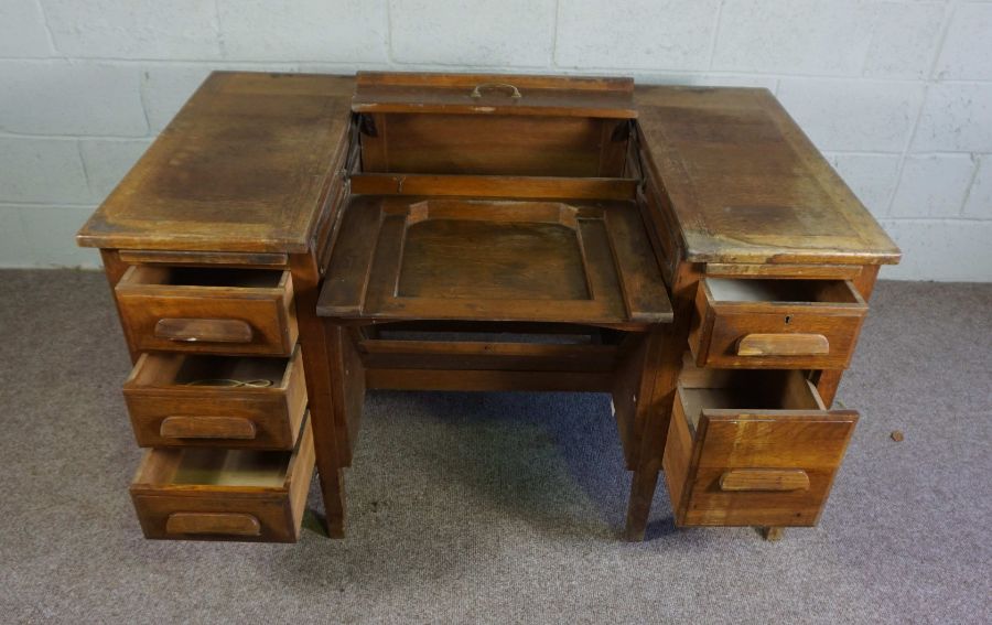 An oak typists desk, early 20th century, the rectangular top with folding and recessed typewriter - Image 4 of 7