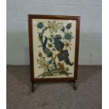A firescreen, early 20th century, with an embroidered panel depicting a squirrel beneath colourful