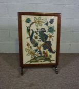 A firescreen, early 20th century, with an embroidered panel depicting a squirrel beneath colourful