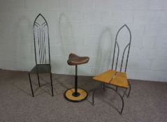 Two Contemporary Gothic iron framed high backed chairs, one with an oak seat, together with an