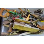 A quantity of assorted garden and workshop tools, including four hand axes, saws, plane and other