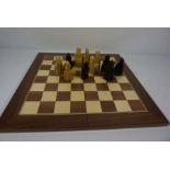 A modern Lewis Chessmen ‘Traditional Games Company‘ chess set and board, together with a small