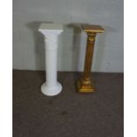 Two jardiniere stands, both in the form of Classical columns, one white ceramic, 86cm high, the