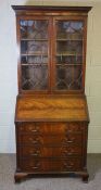 A George III style mahogany bureau bookcase, late 19th century or early 20th century,  with a