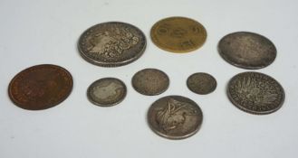 A group of assorted coins including: A USA silver one dollar, 1885;  German States, Prussia, Two