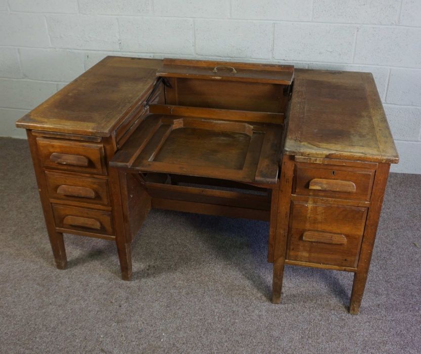 An oak typists desk, early 20th century, the rectangular top with folding and recessed typewriter - Image 5 of 7