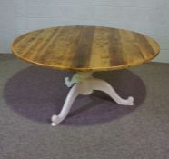 A stained pine and painted Victorian style breakfast table, with a circular plain planked top and