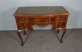 A Georgian Style writing table, 20th century reproduction, with serpentine leathered top and